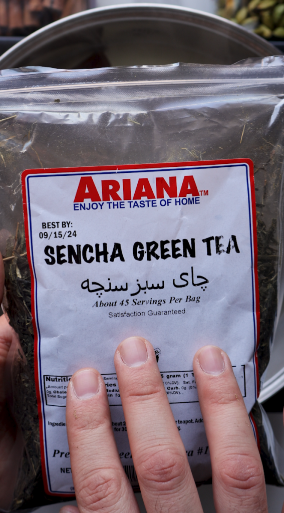 Green tea going into boiling water